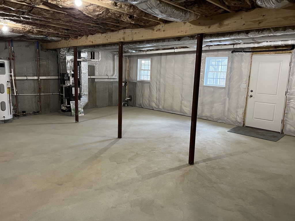 40 A Titus Way, Unit 40A Taunton, MA 02780 - Photo 13 of 16 a view of empty room with wooden walls
