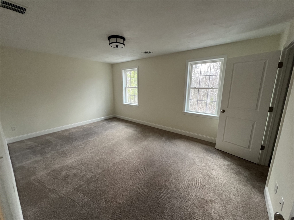 40 A Titus Way, Unit 40A Taunton, MA 02780 - Photo 9 of 16 an empty room with windows