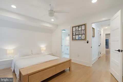 a spacious bedroom with a bed and a walk in closet