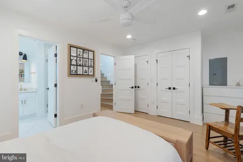 a bedroom with a bed and a view of bathroom