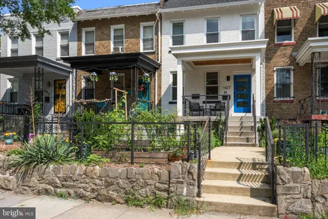 a front view of a building with garden