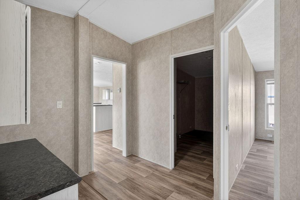 154 Firefly Drive Springtown, TX 76082 - Photo 35 of 39 a view of a hallway with wooden floor and staircase