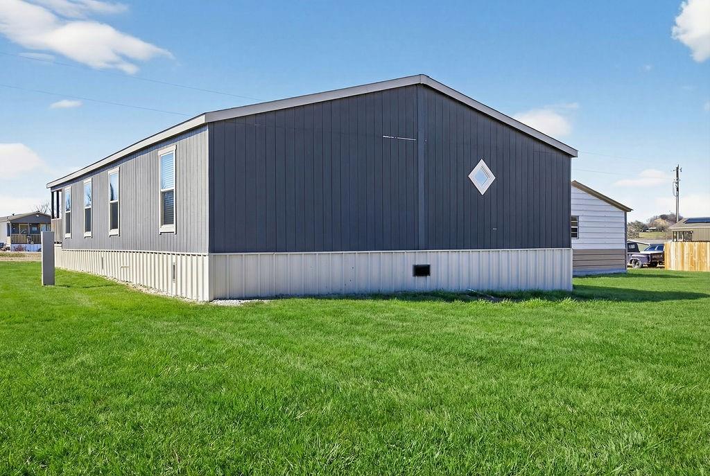 154 Firefly Drive Springtown, TX 76082 - Photo 36 of 39 a front view of a house with a yard