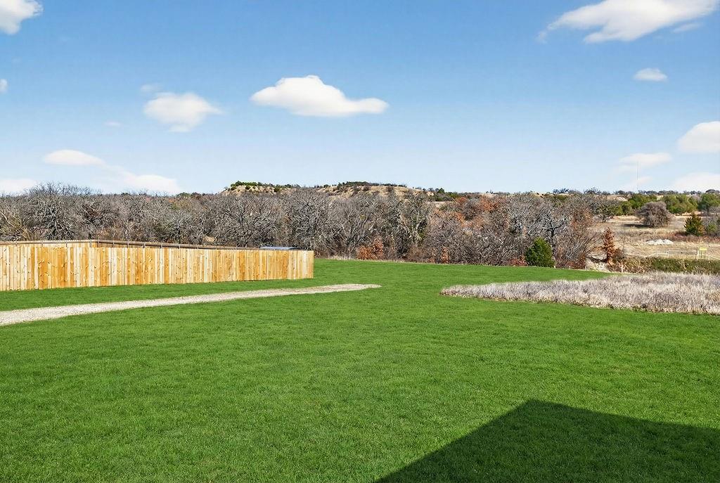 154 Firefly Drive Springtown, TX 76082 - Photo 39 of 39 a view of a lake and green valley