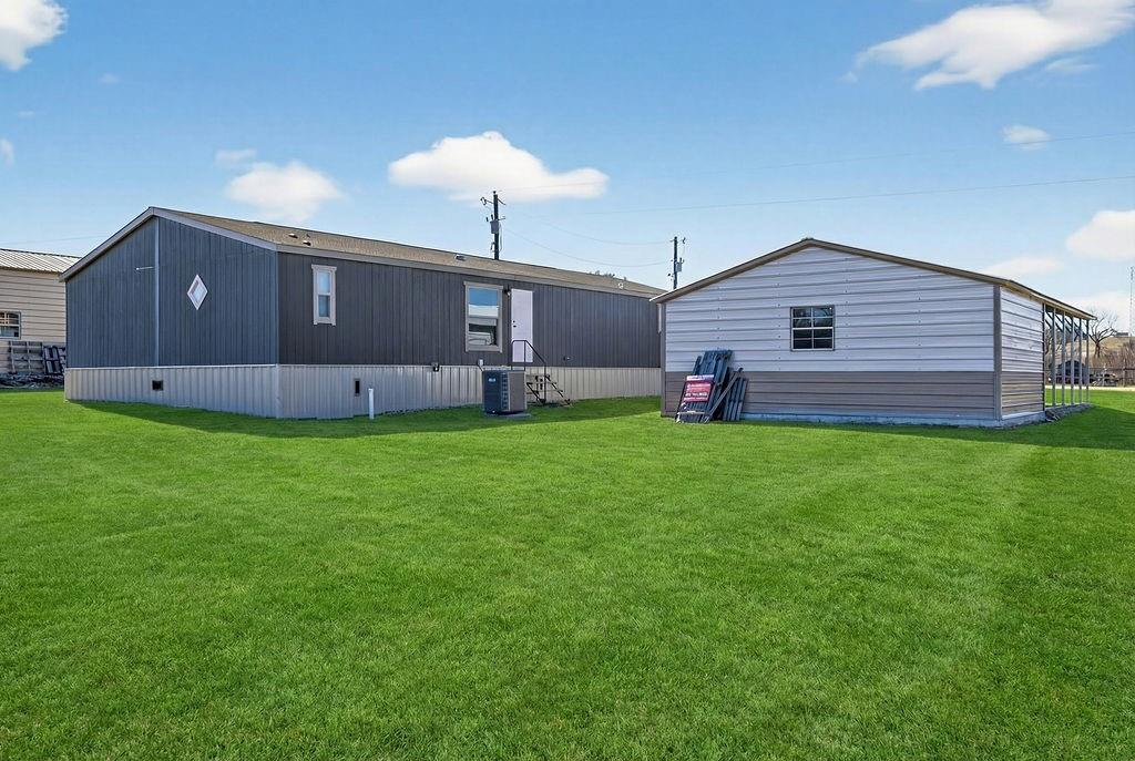 154 Firefly Drive Springtown, TX 76082 - Photo 4 of 39 a front view of a house with a yard and garage