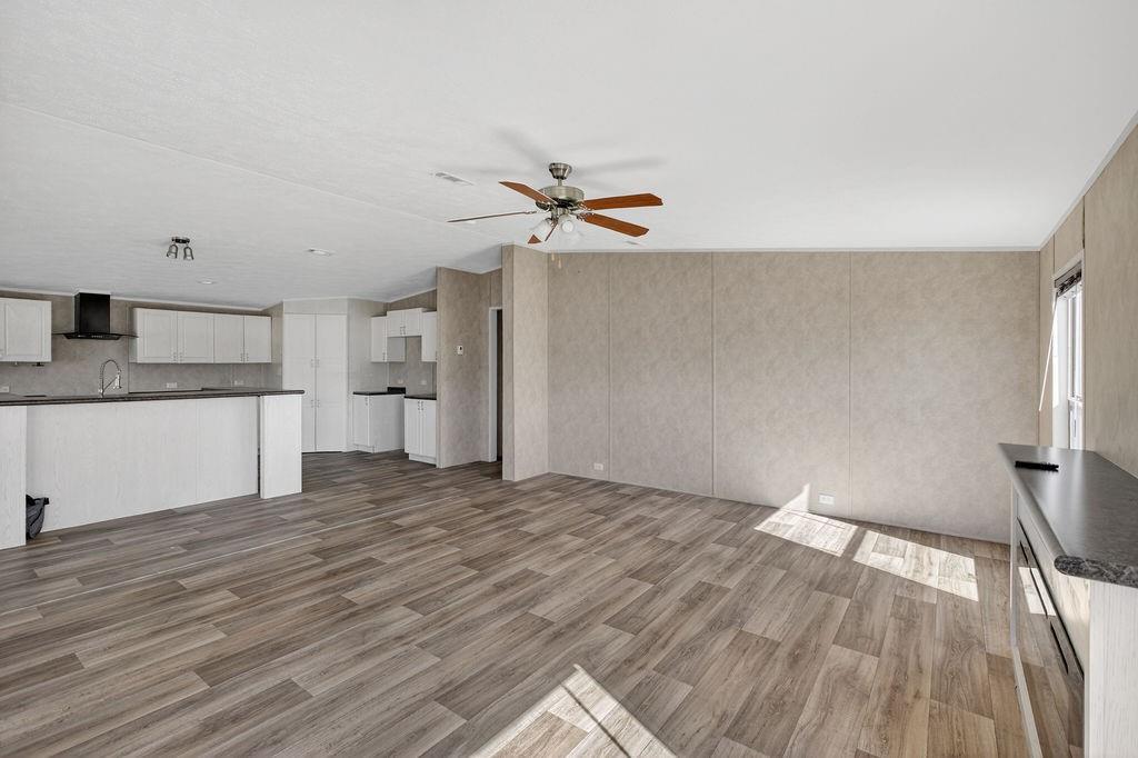 154 Firefly Drive Springtown, TX 76082 - Photo 6 of 39 a view of a kitchen with wooden floor and a sink