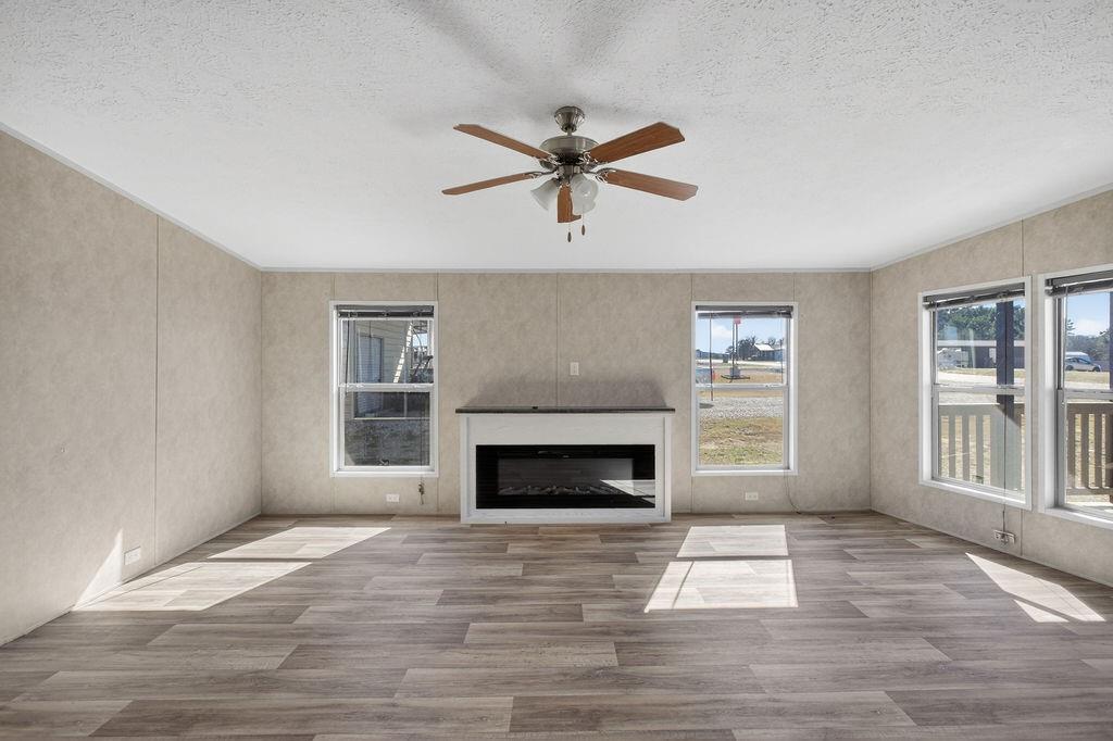 154 Firefly Drive Springtown, TX 76082 - Photo 9 of 39 a view of a livingroom with a fireplace and window
