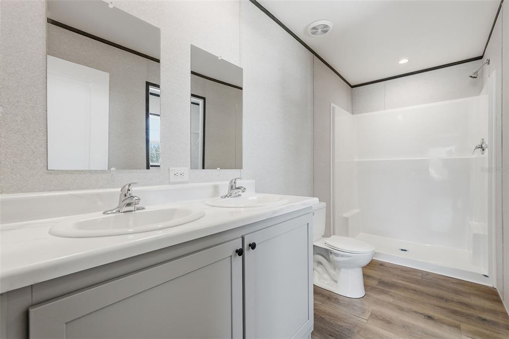 16837 Lashua Drive Spring Hill, FL 34610 - Photo 18 of 37 a bathroom with a sink and a mirror