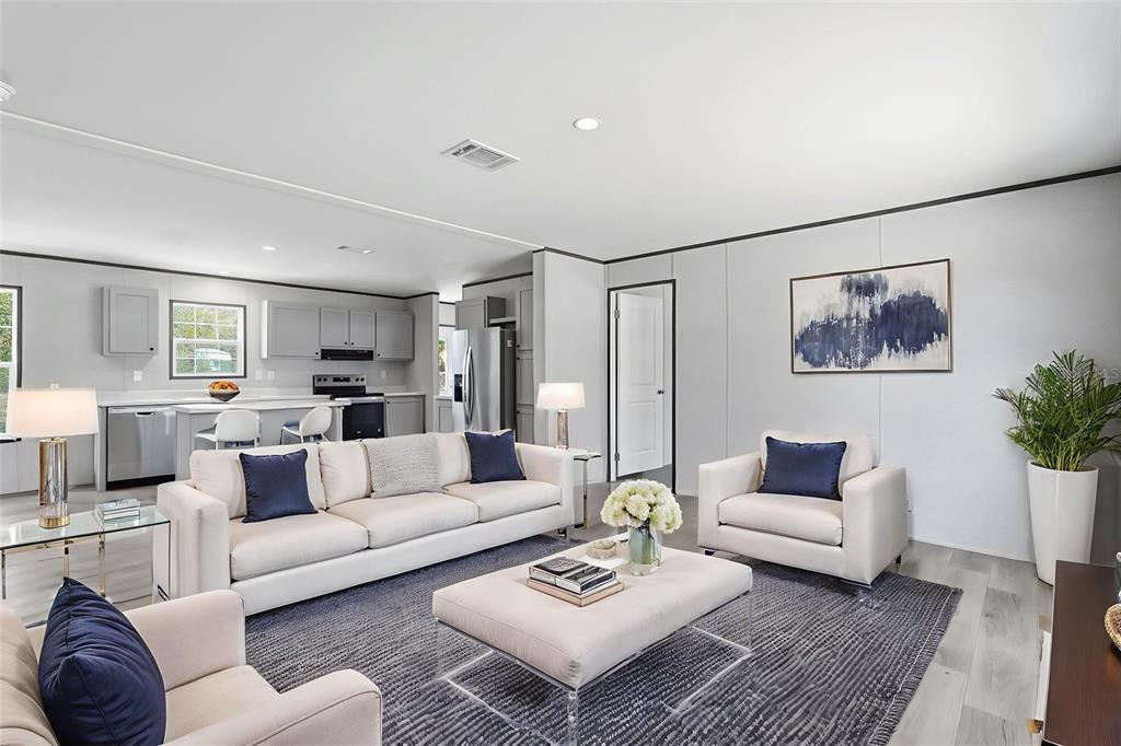 16837 Lashua Drive Spring Hill, FL 34610 - Photo 2 of 37 a living room with furniture and a wooden floor