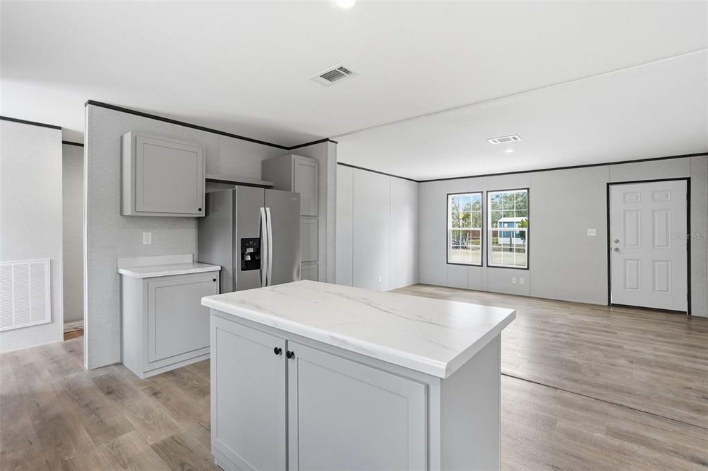 16837 Lashua Drive Spring Hill, FL 34610 - Photo 22 of 37 a view of cabinets and wooden floor