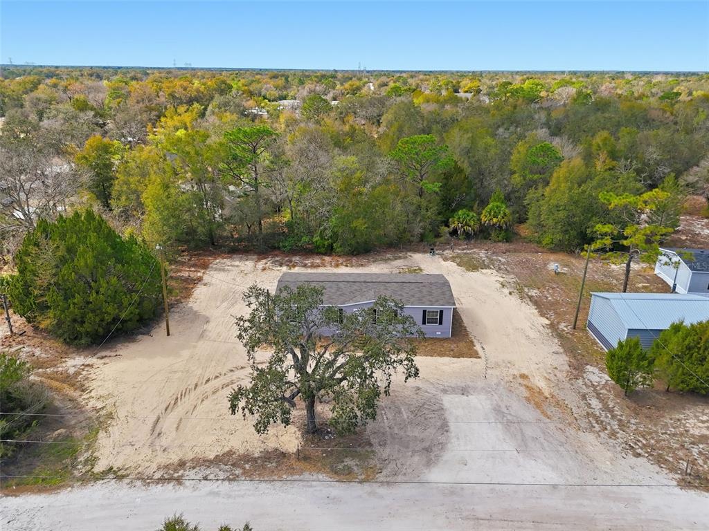 16837 Lashua Drive Spring Hill, FL 34610 - Photo 30 of 37 a view of a road with a yard