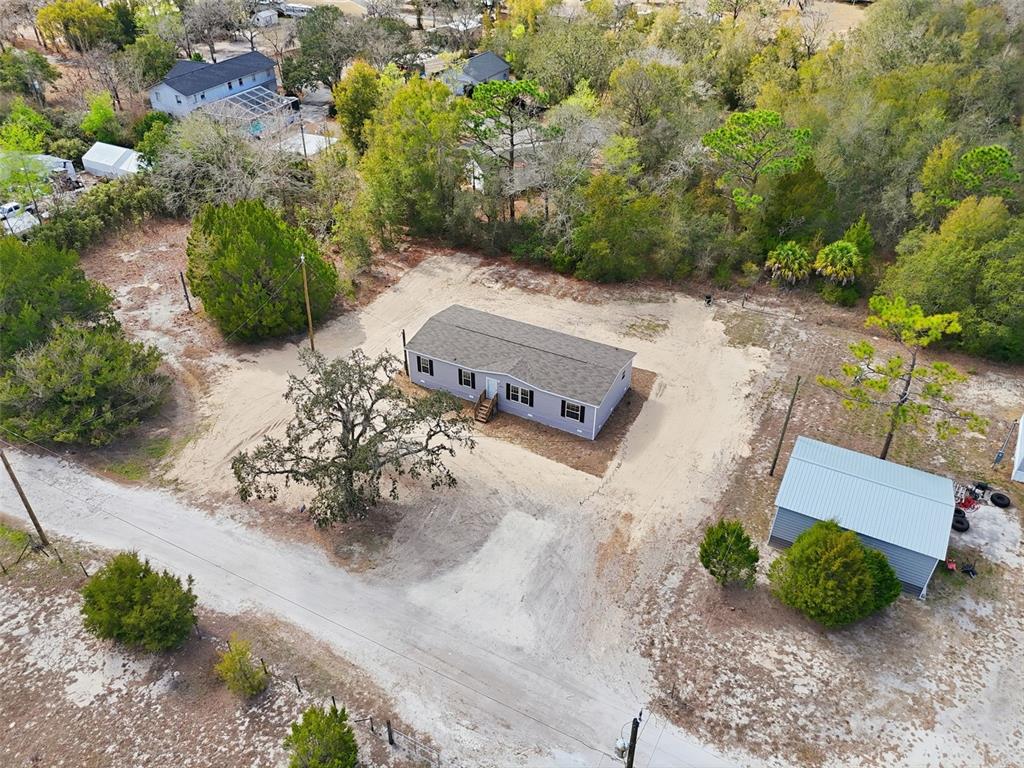 16837 Lashua Drive Spring Hill, FL 34610 - Photo 31 of 37 an aerial view of a house with a yard