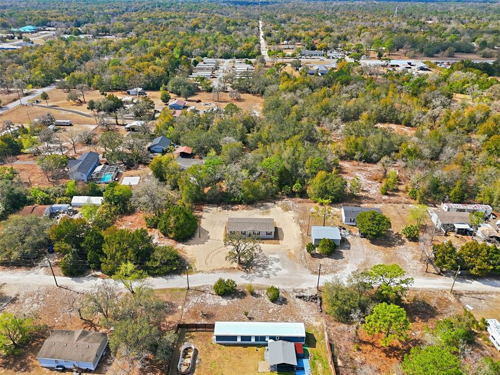 16837 Lashua Drive Spring Hill, FL 34610 - Photo 34 of 37 an aerial view of residential houses with outdoor space