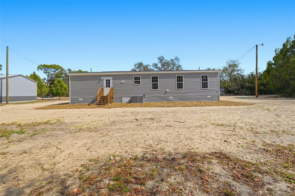 16837 Lashua Drive Spring Hill, FL 34610 - Photo 37 of 37 a view of a house with a yard