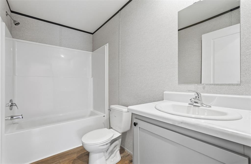 16837 Lashua Drive Spring Hill, FL 34610 - Photo 4 of 37 a bathroom with a sink toilet and a bathtub