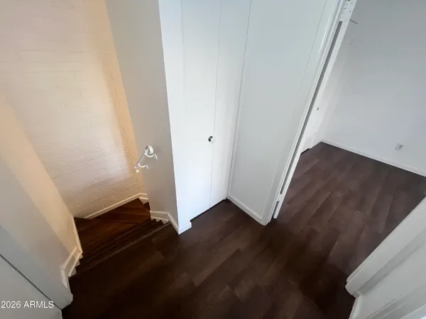 an empty room with wooden floor