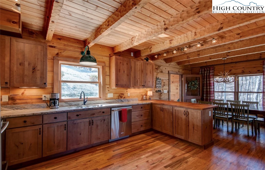 337 Rivers Crest Road Boone, NC 28607 - Photo 15 of 46 a kitchen with lots of counter top space and dining table