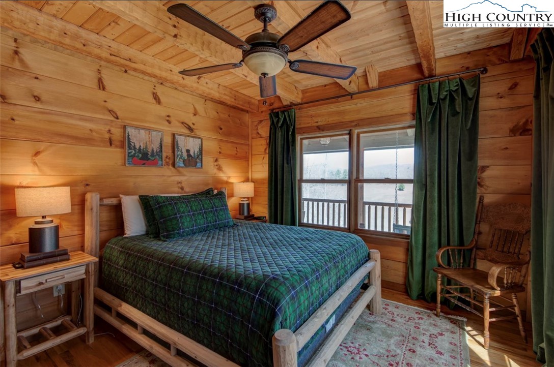 337 Rivers Crest Road Boone, NC 28607 - Photo 23 of 46 a bed sitting in a bedroom next to a window