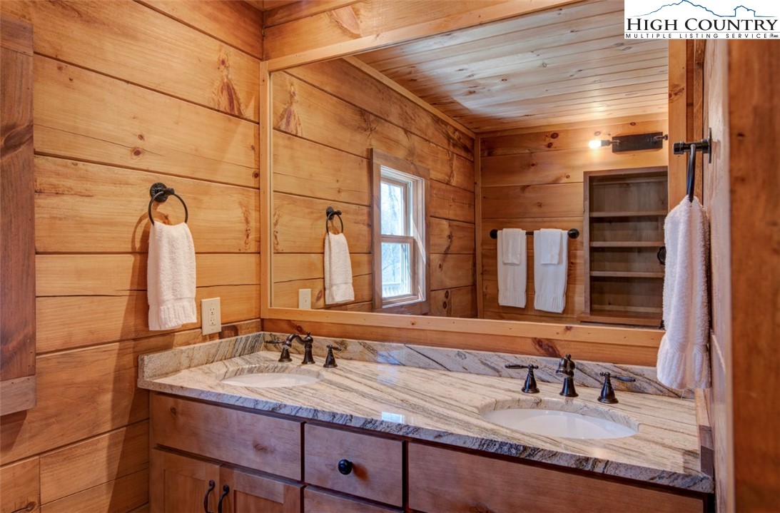 337 Rivers Crest Road Boone, NC 28607 - Photo 25 of 46 a bathroom with a sink and a mirror