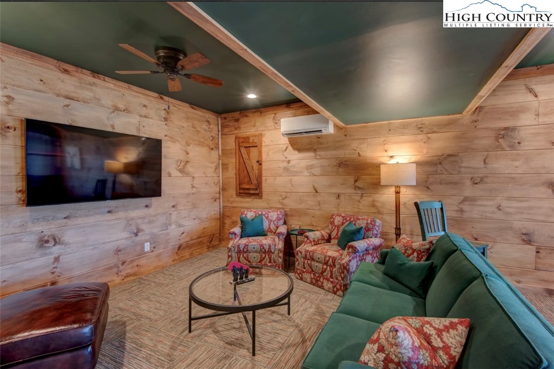 337 Rivers Crest Road Boone, NC 28607 - Photo 34 of 46 a living room with furniture and a flat screen tv