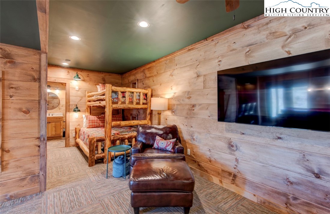 337 Rivers Crest Road Boone, NC 28607 - Photo 36 of 46 a living room with furniture and a flat screen tv