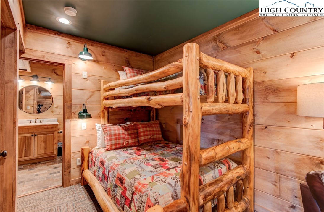 337 Rivers Crest Road Boone, NC 28607 - Photo 37 of 46 a bedroom with a bed and a view of bathroom