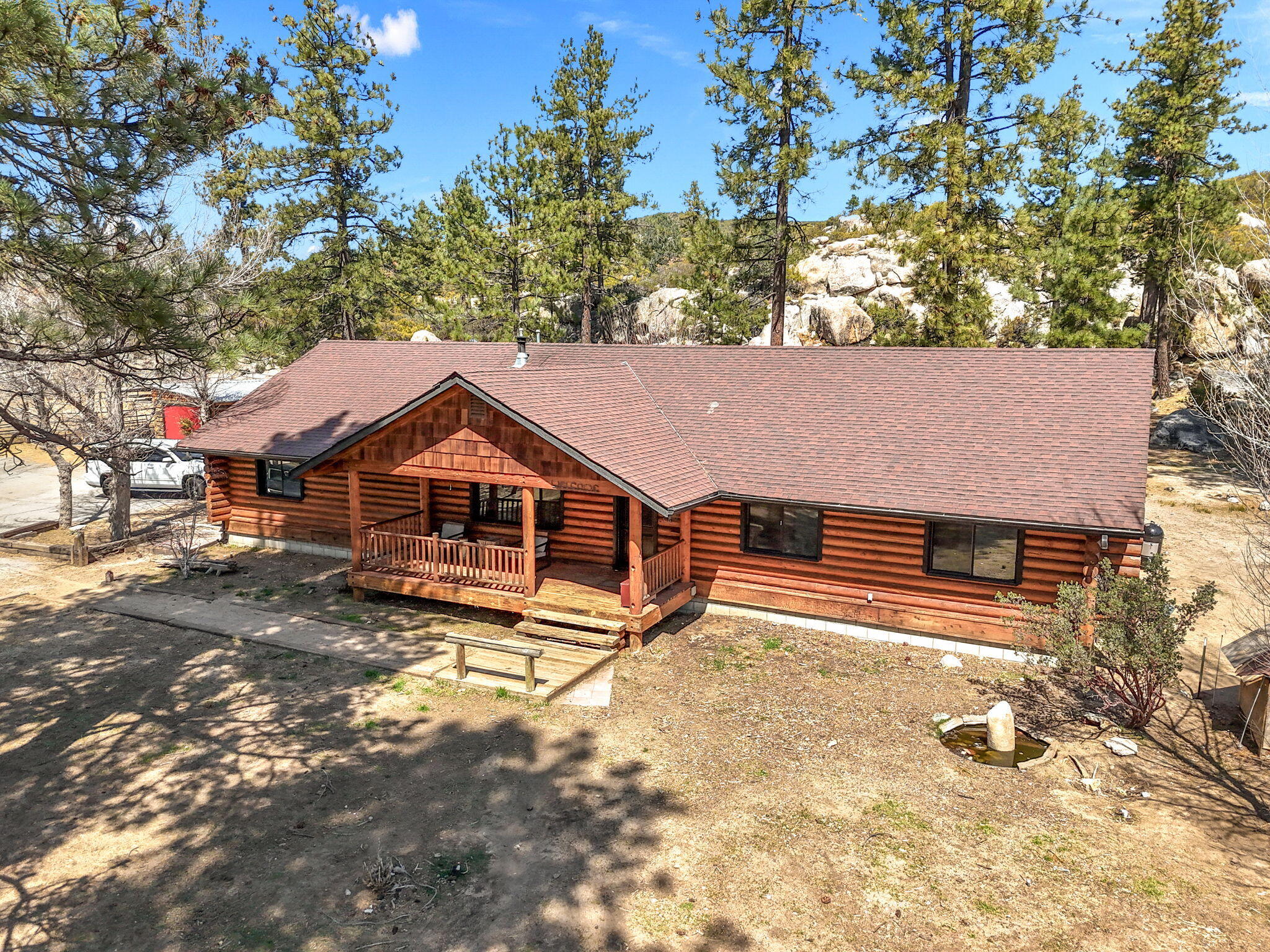 60640 Table Mountain Road Mountain Center, CA 92561 - Photo 1 of 53 a view of a house with a yard covered in snow