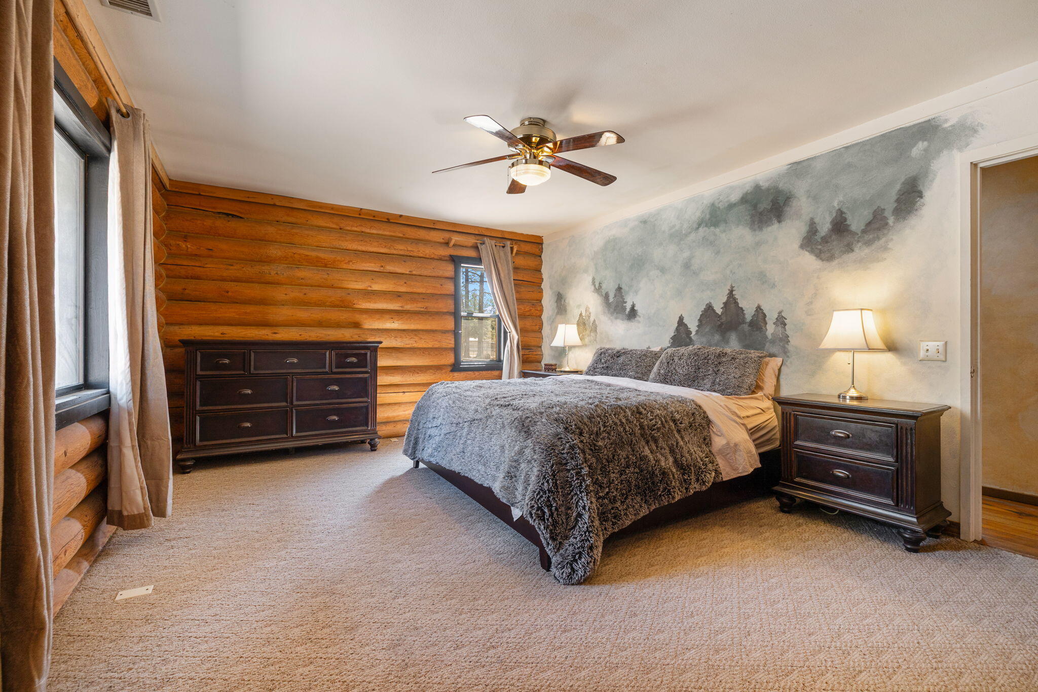 60640 Table Mountain Road Mountain Center, CA 92561 - Photo 19 of 53 a bedroom with a bed and a ceiling fan