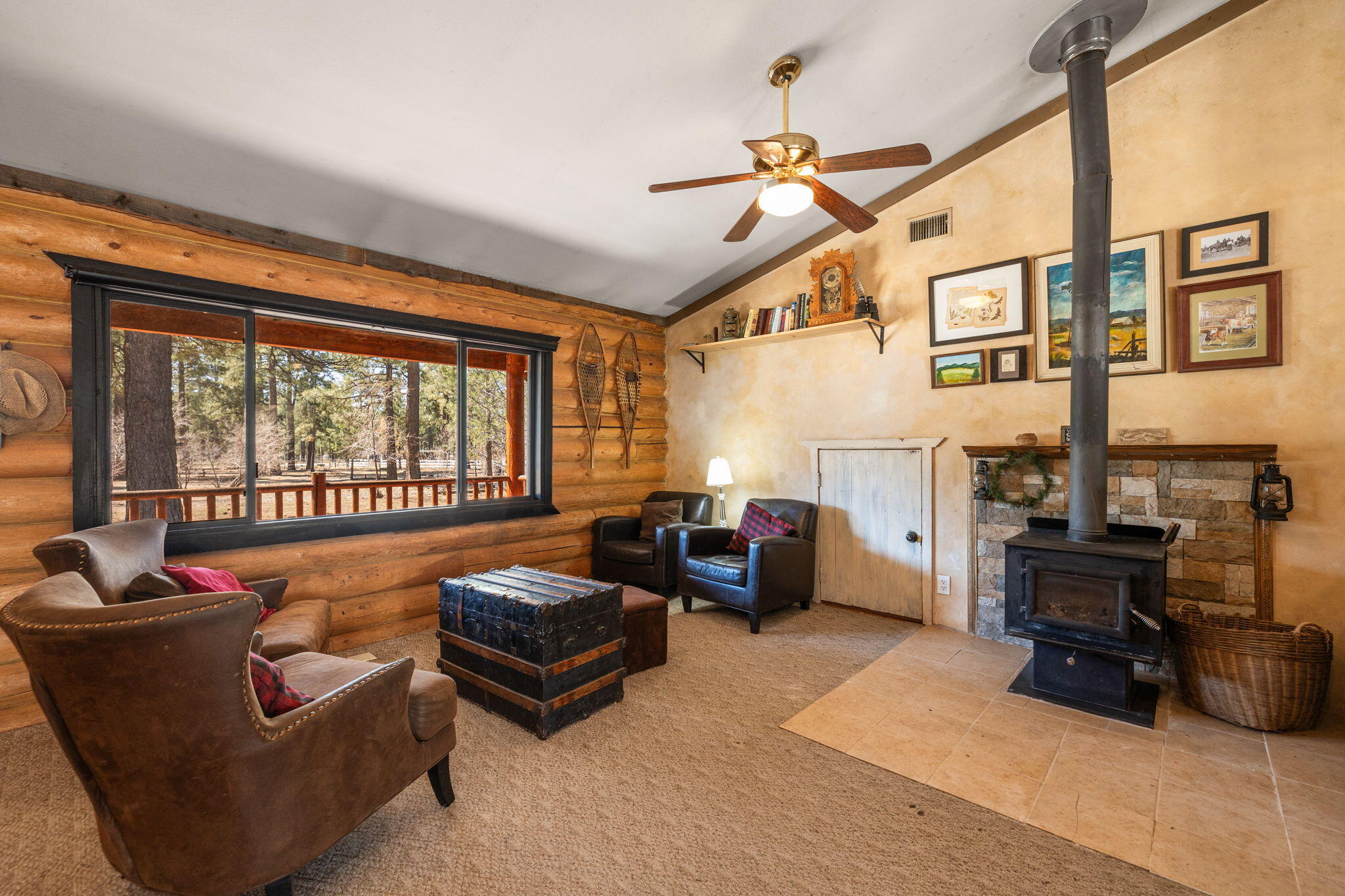 60640 Table Mountain Road Mountain Center, CA 92561 - Photo 6 of 53 a living room with furniture ceiling fan and a window