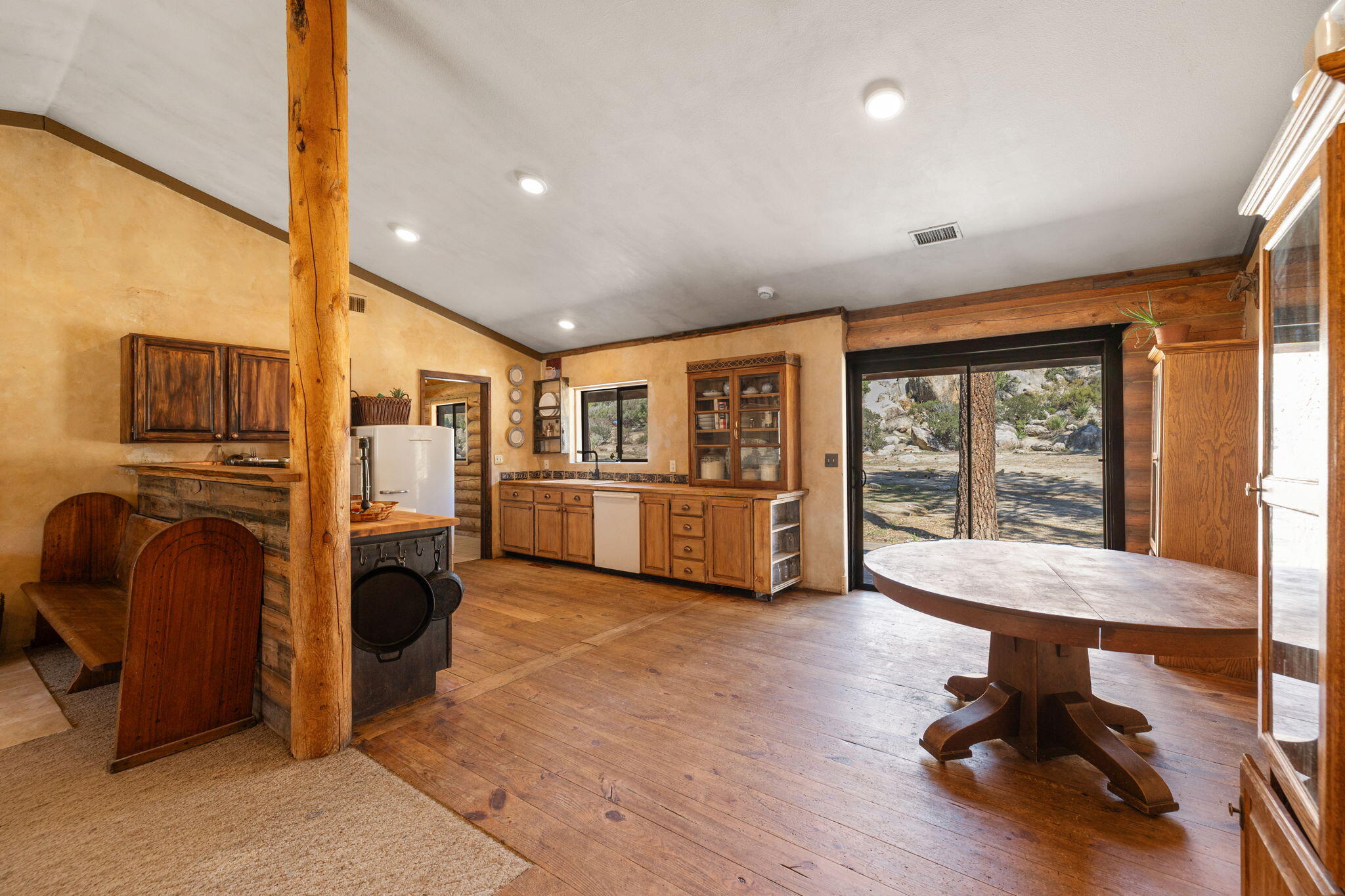 60640 Table Mountain Road Mountain Center, CA 92561 - Photo 9 of 53 a living room with furniture a fireplace and a flat screen tv