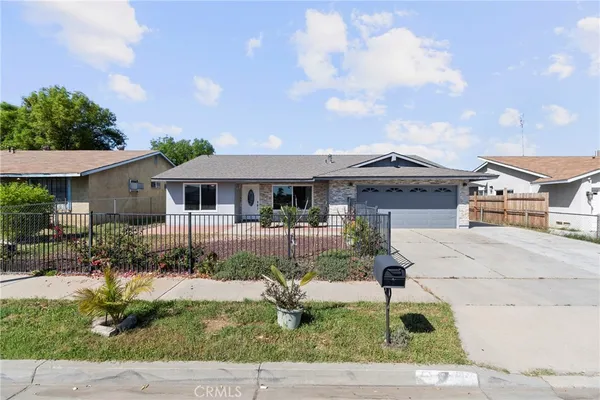 front view of a house with a garden