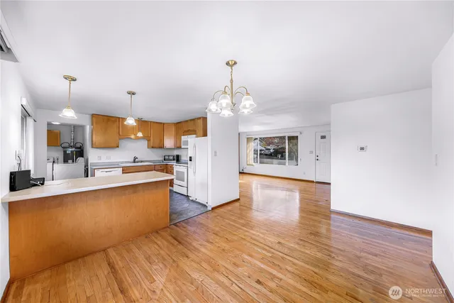 a kitchen with stainless steel appliances a sink stove and refrigerator