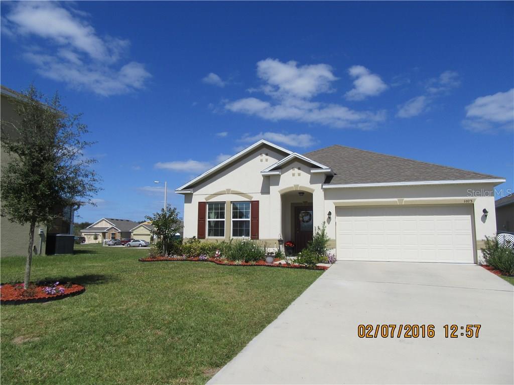 Exterior showing new landscaping & extra driveway parking for guests.
