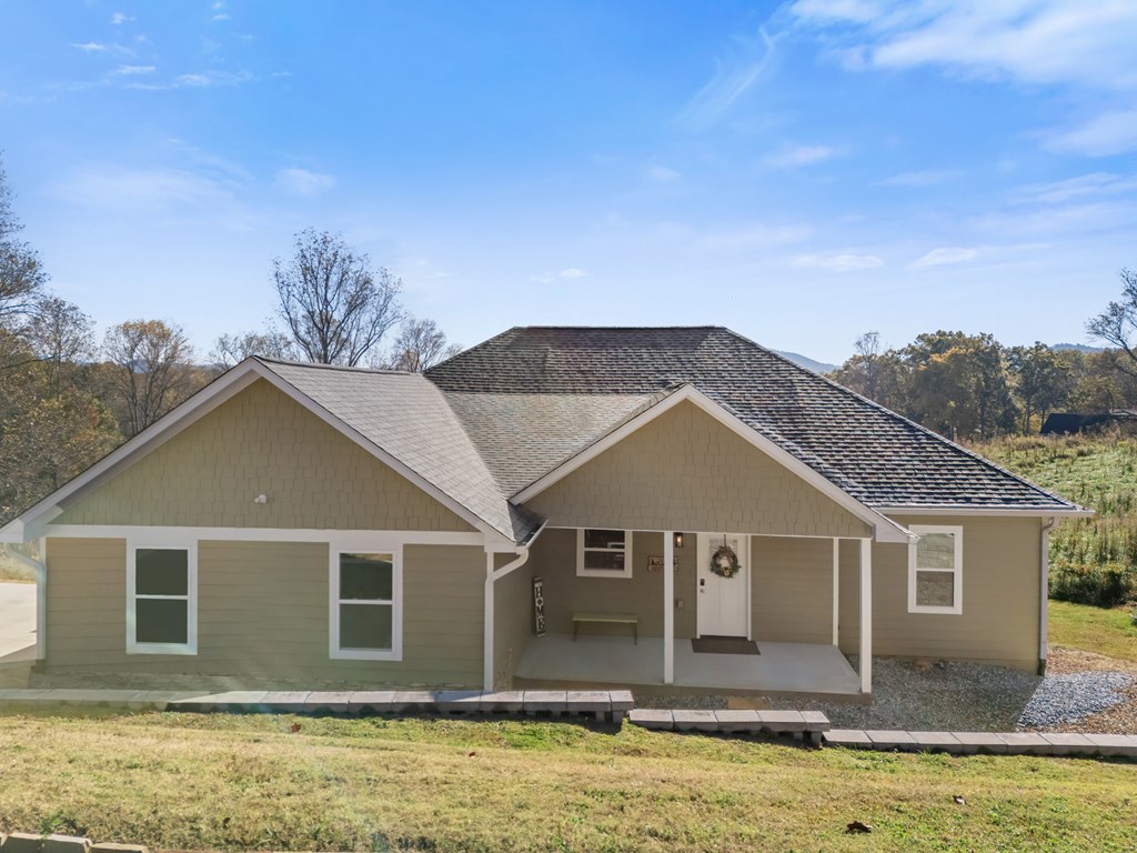 308 Mystic Ridge Blairsville, GA 30512 - Photo 25 of 68 a front view of house with yard and trees in the background
