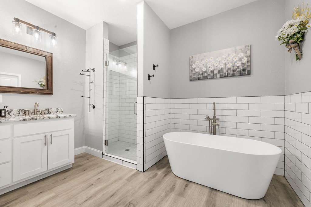 308 Mystic Ridge Blairsville, GA 30512 - Photo 36 of 68 a bathroom with a white tub a vanity and a sink