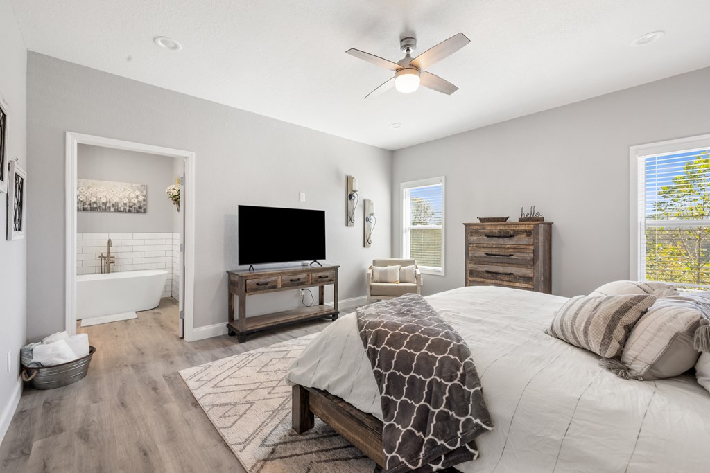 308 Mystic Ridge Blairsville, GA 30512 - Photo 37 of 68 a bedroom with a bed and a flat screen tv