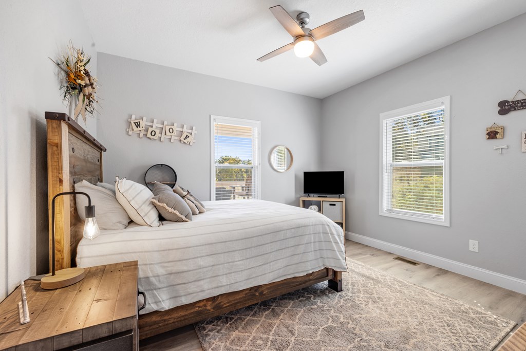 308 Mystic Ridge Blairsville, GA 30512 - Photo 49 of 68 a bedroom with a bed and a chandelier