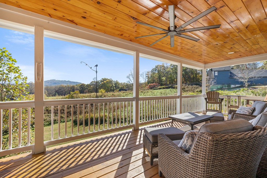 308 Mystic Ridge Blairsville, GA 30512 - Photo 5 of 68 a balcony with furniture and wooden floor