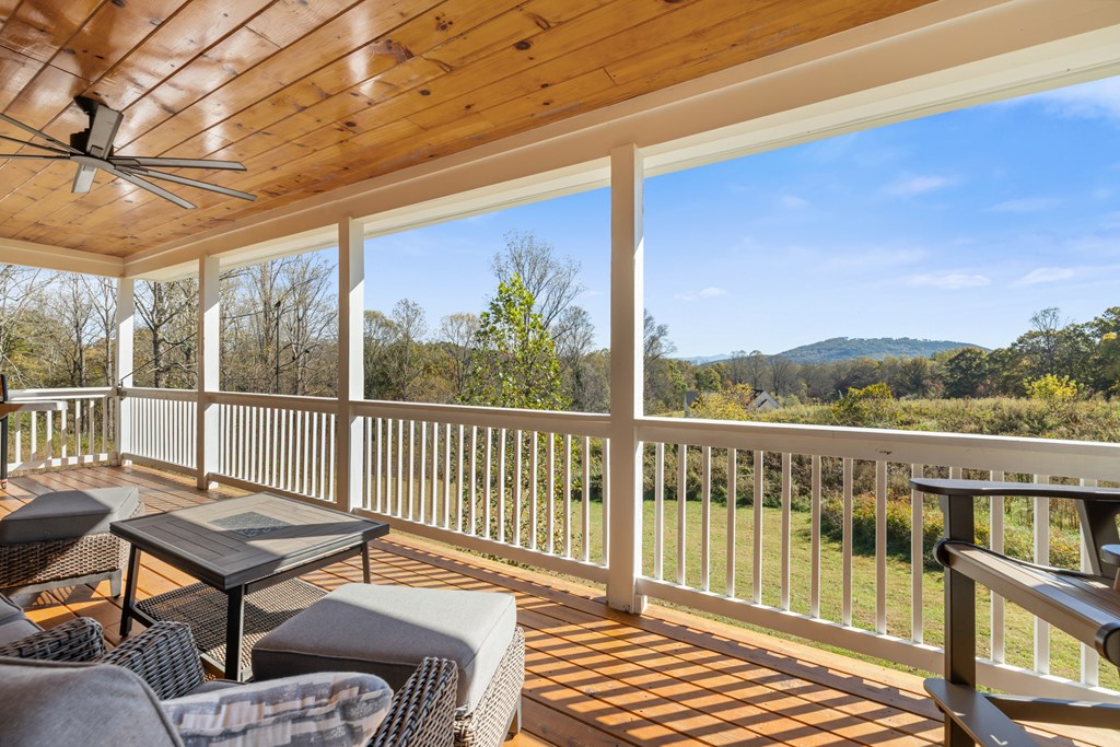 308 Mystic Ridge Blairsville, GA 30512 - Photo 6 of 68 a balcony of a house with wooden floor outdoor seating and yard in the back