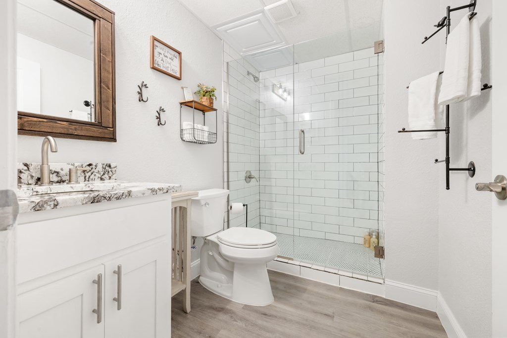 308 Mystic Ridge Blairsville, GA 30512 - Photo 61 of 68 a bathroom with a sink toilet vanity and shower