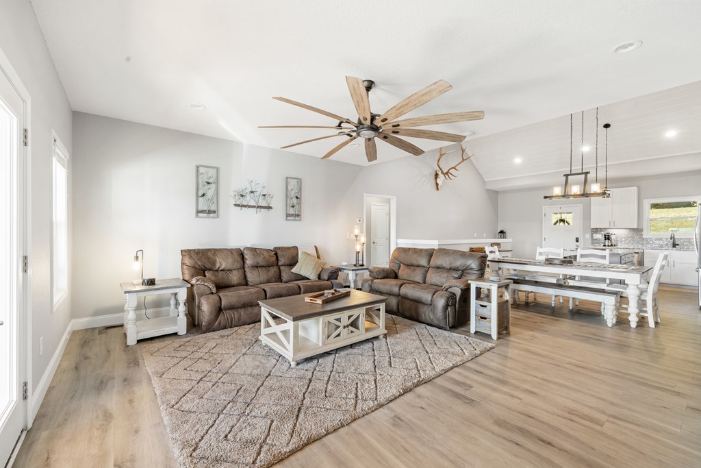 308 Mystic Ridge Blairsville, GA 30512 - Photo 10 of 68 a living room with furniture kitchen view and a chandelier