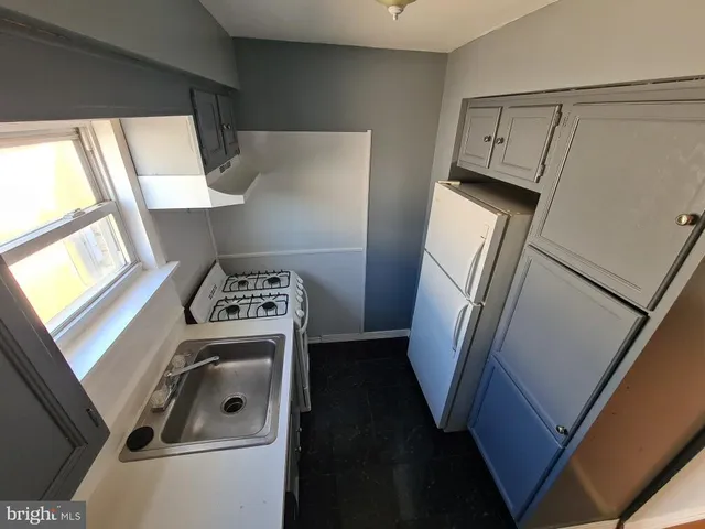 a view of washer and dryer with wooden floor