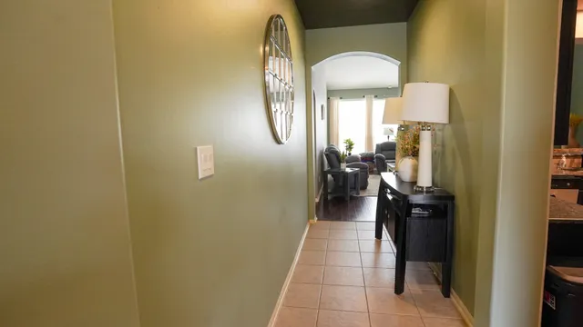 a hallway with a view of living room