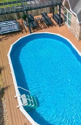 a view of a swimming pool with an outdoor seating
