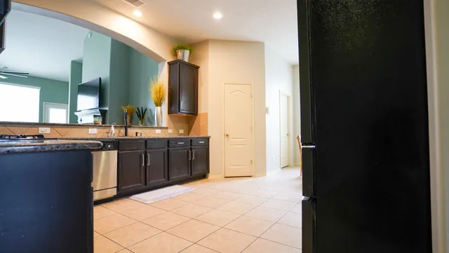 a bathroom with a sink and a large mirror