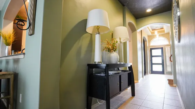 a kitchen with a sink and chandelier