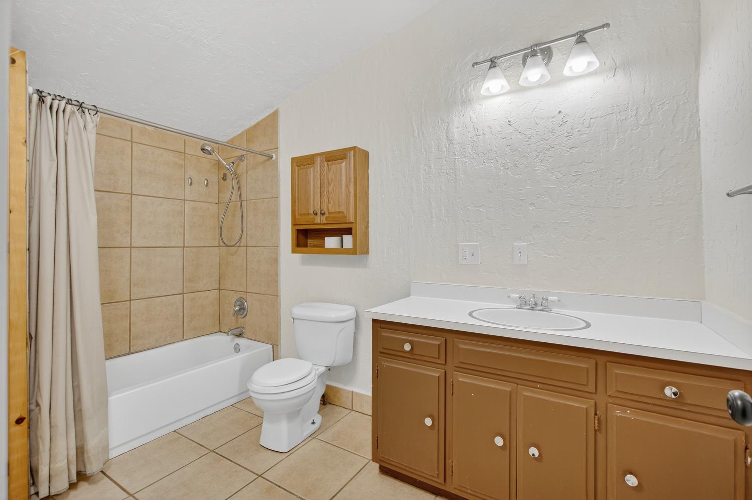 36 Crystal Pines Road Oroville, CA 95965 - Photo 20 of 26 a bathroom with a sink toilet and shower