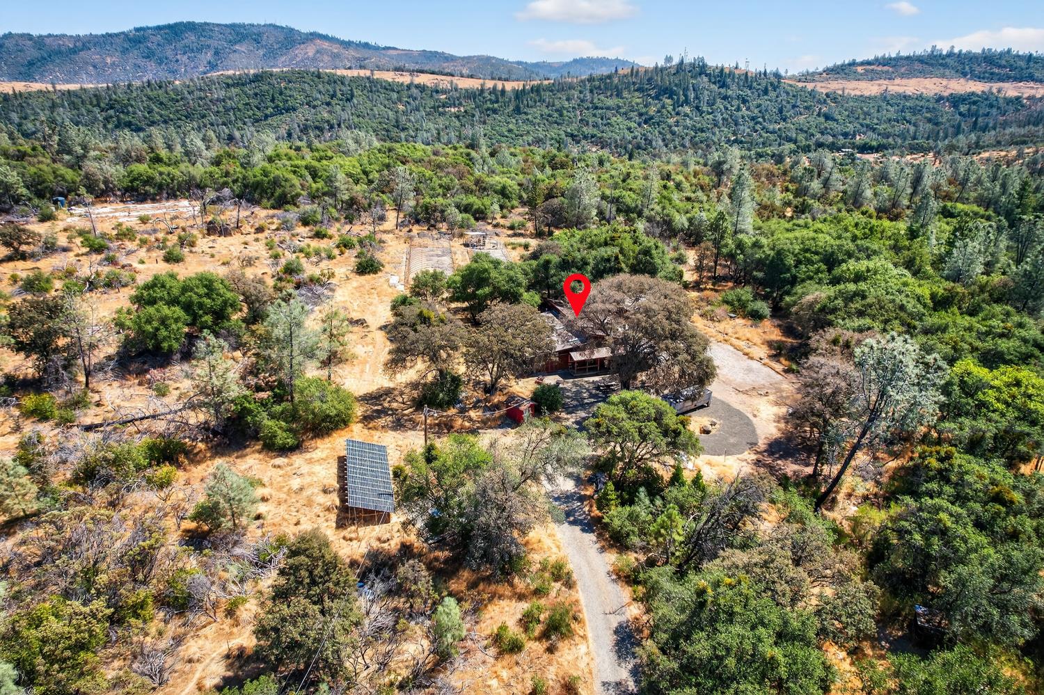 36 Crystal Pines Road Oroville, CA 95965 - Photo 25 of 26 a view of a houses with a lush green hillside