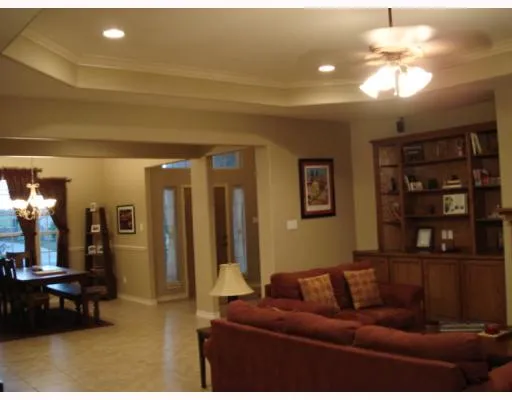 a living room with furniture and a lamp
