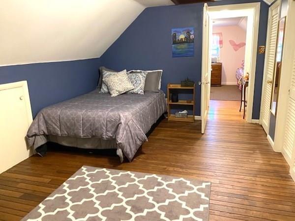 599 Union Street Braintree, MA 02184 - Photo 11 of 17 a bedroom with a bed and wooden floor